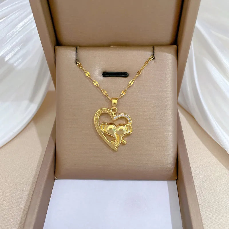 Minimalist gold necklaces for women -Wholesale Simple Style Classic Style Heart Shape Elephant Titanium Steel Copper Hollow Out Inlay Zircon Pendant Necklace