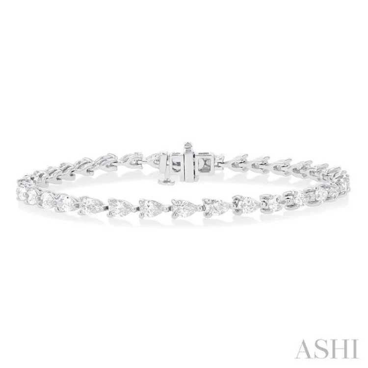 Statement bracelets for women -4 ctw East West Pear Cut Diamond Fashion Tennis Bracelet in 14K White Gold